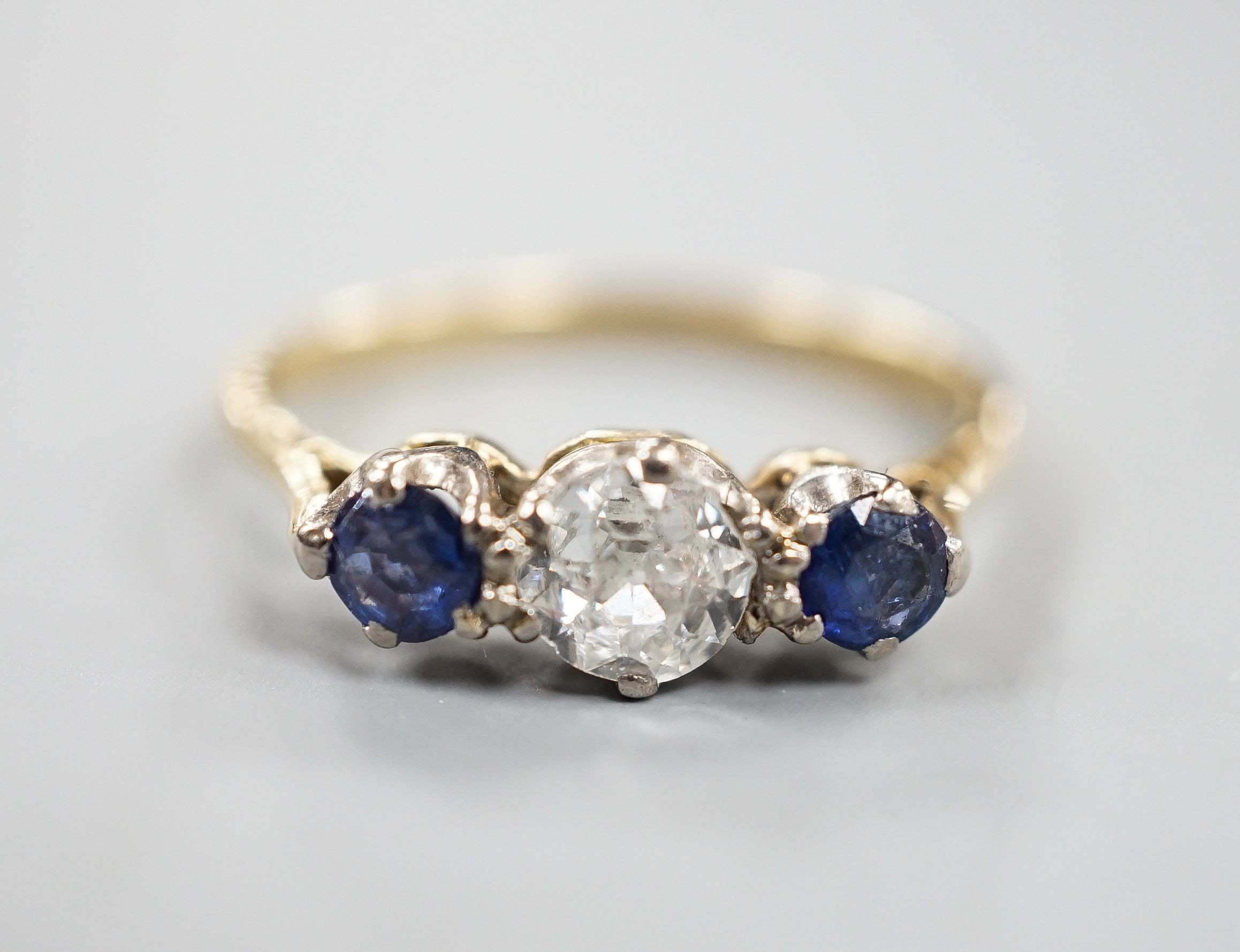 An 18ct & Plat, two stone sapphire and single stone diamond ring, size R, gross weight 3.1 grams.